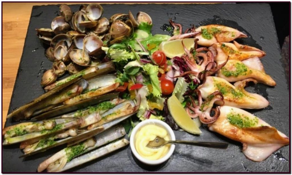 Restaurant El Carlit de Neu Steakhouse. Le paradis des paellas de fruits de mer, poissons et crustacés au Pas de la Case.